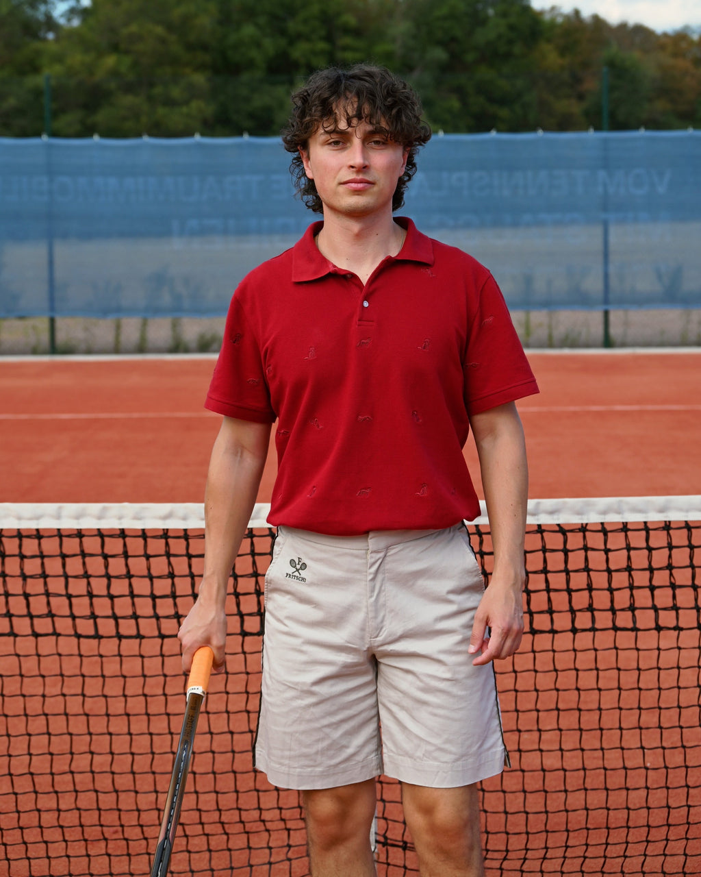 The Fox Polo, racquet in hand at the net