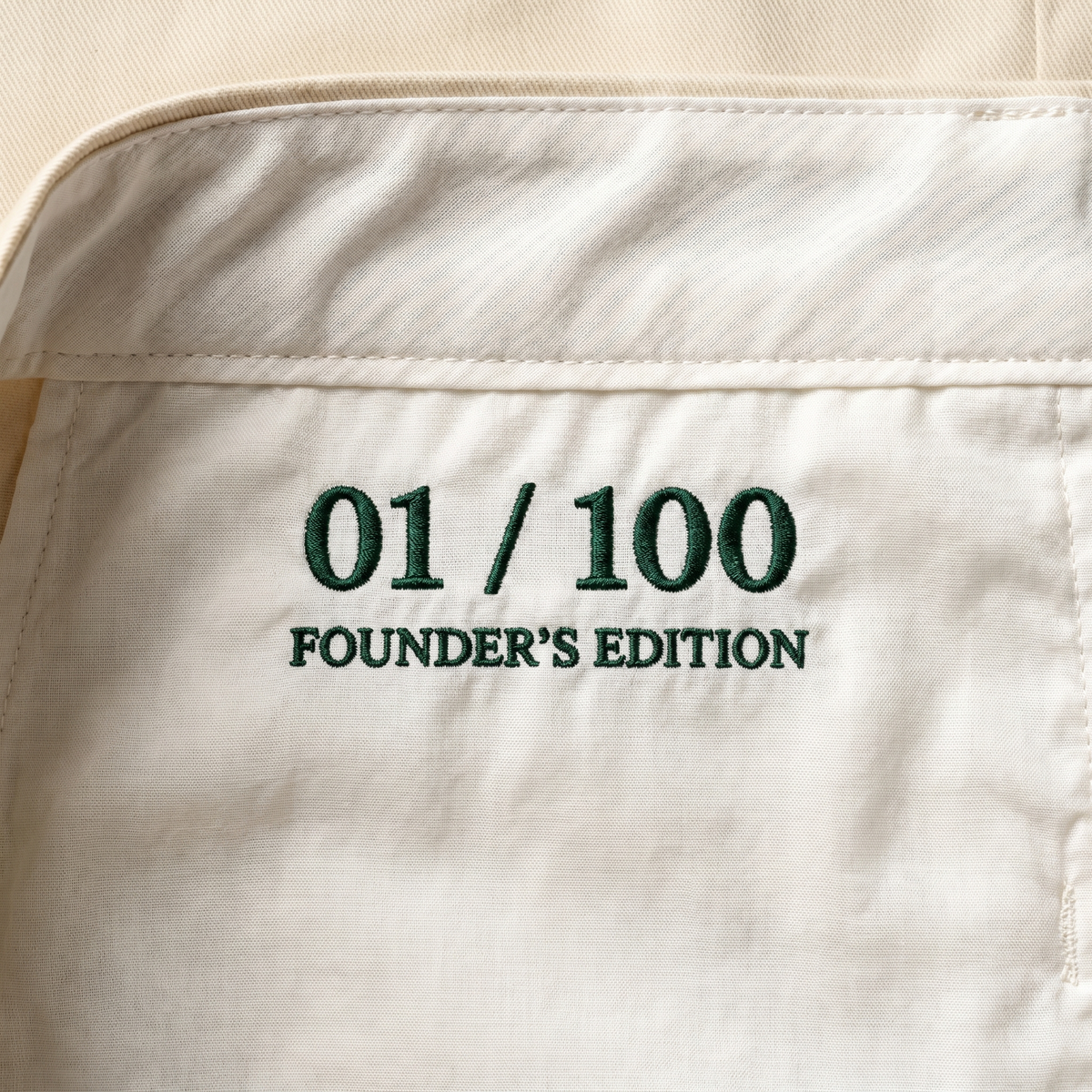 Inside back waistband — hand-numbered 01 / 100 Founder's Edition.